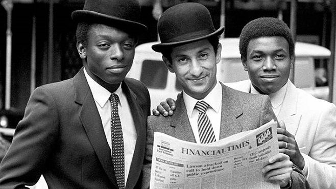 Players Garth Crooks, Ossie Ardiles and Danny Thomas pose as City gents outside the London Stock Exchange on the club’s first day of share dealings